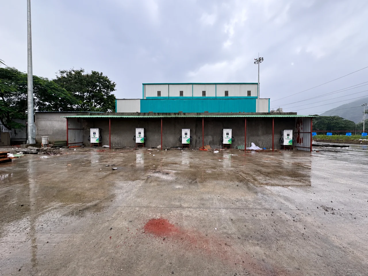 Several charging units arranged beneath an outdoor shelter.